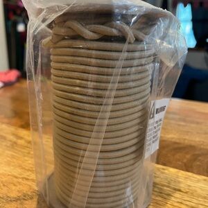 100 feet of 3/16 of an inch tan bungee cord unused spool